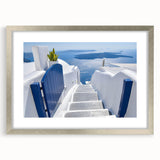 Extra large abstract art print depicting a textured Santorini landscape in muted blues and whites, framed in silver.