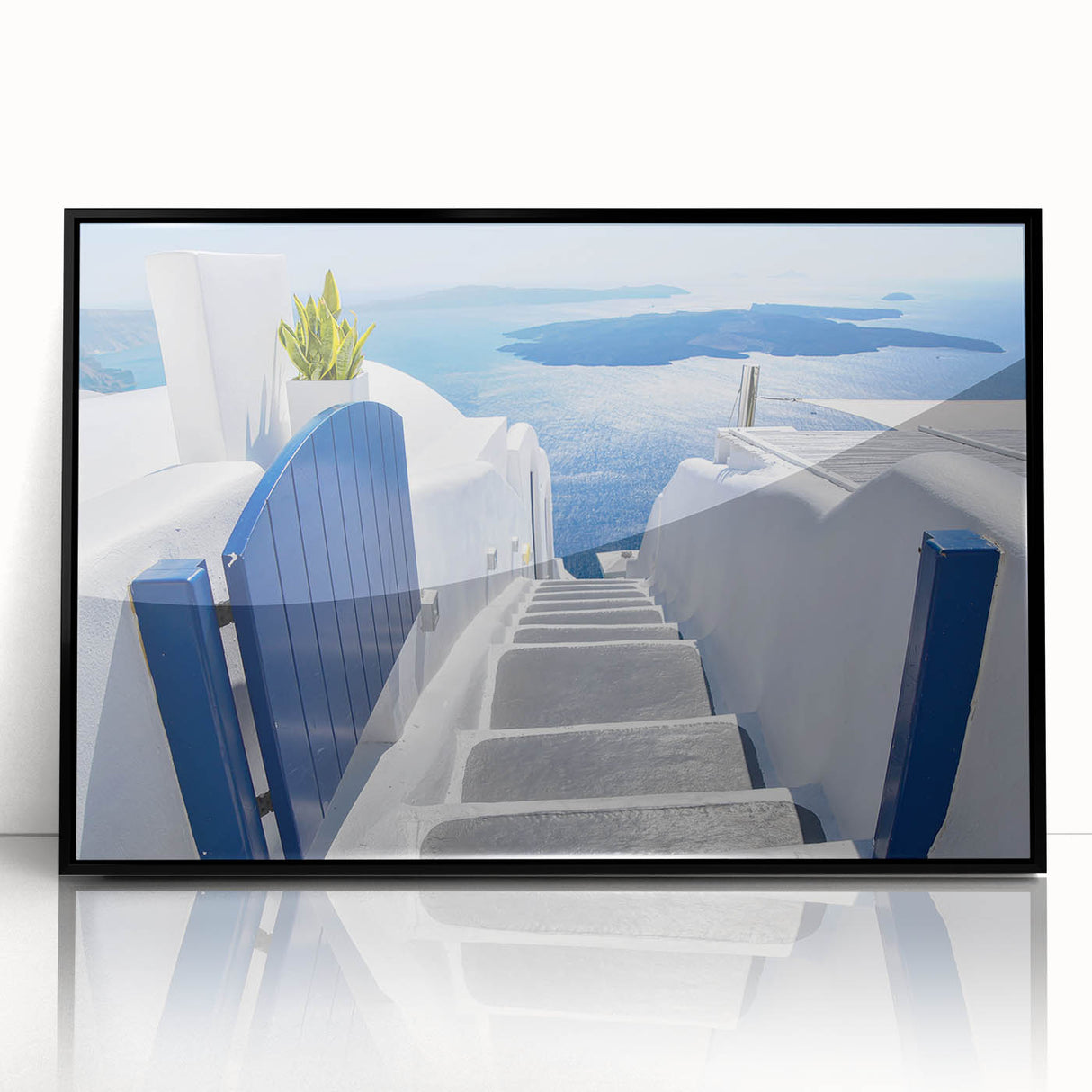 Large abstract wall art depicting the Santorini landscape in vibrant blue and white tones on a framed acrylic.