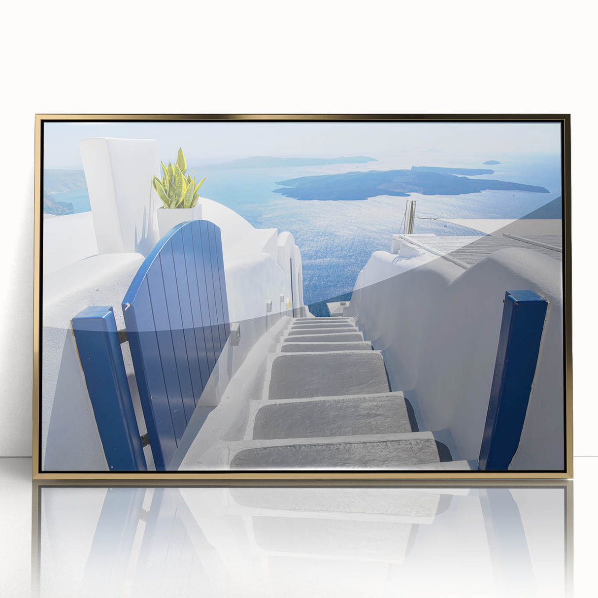 Acrylic print of Santorini scenery with blue and white tones, framed in gold, suitable for modern art wall decor.