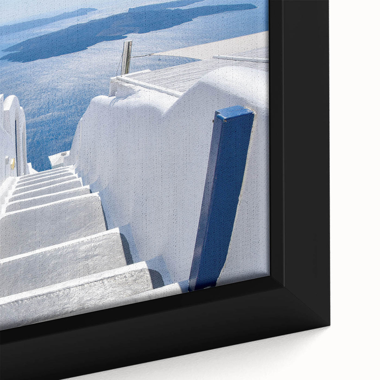 Framed canvas of Santorini scenery in black with colorful, textured details, ideal for living room decor.