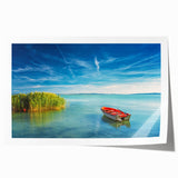 Rolled print of a European scenery depicting floral art in muted green and brown tones.