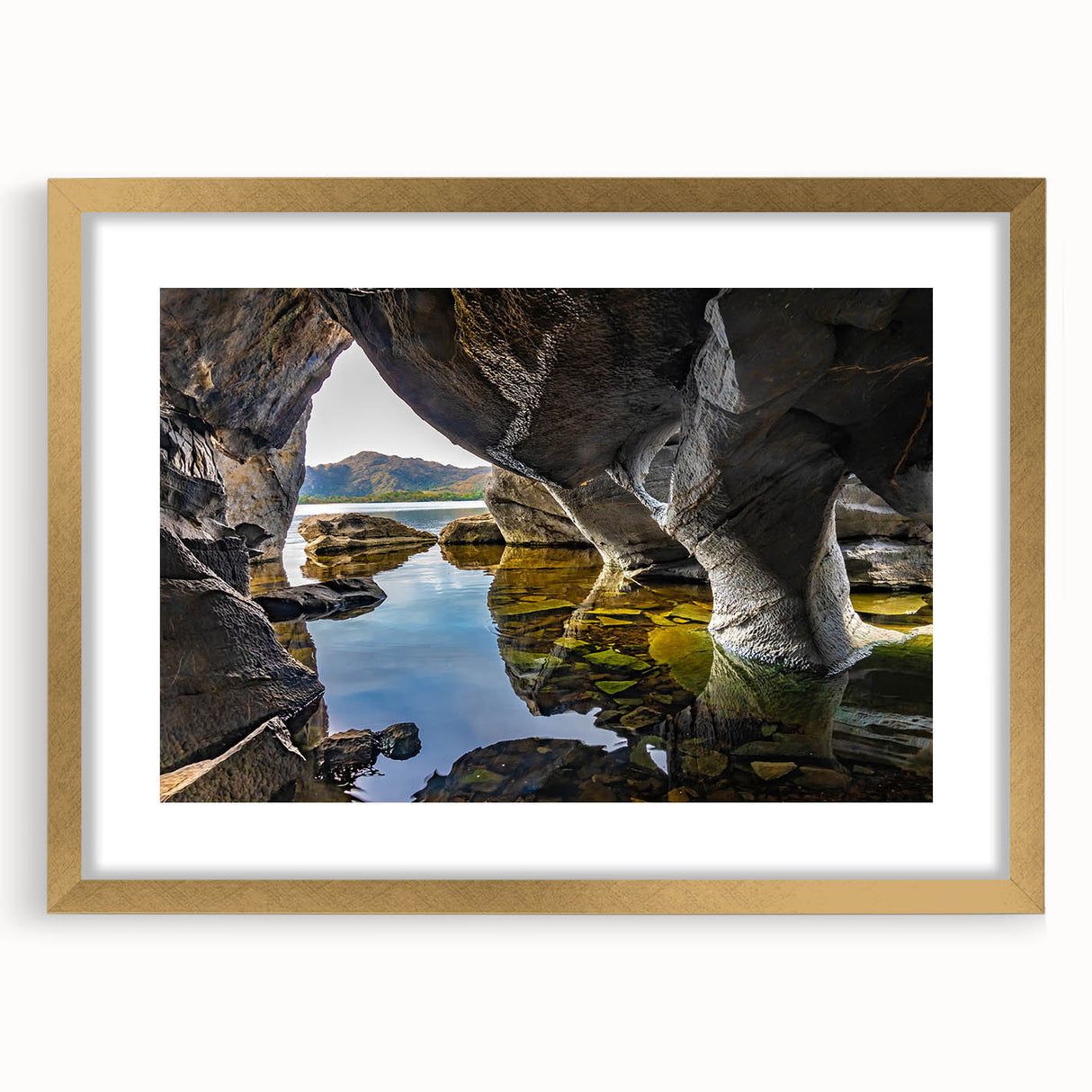 Abstract art print of a European landscape in muted green and blue tones, framed in gold, suitable for dining room decor.