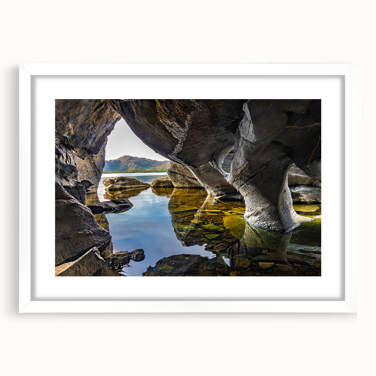 Textured abstract art print of a European landscape in muted green and blue tones on a white framed canvas.