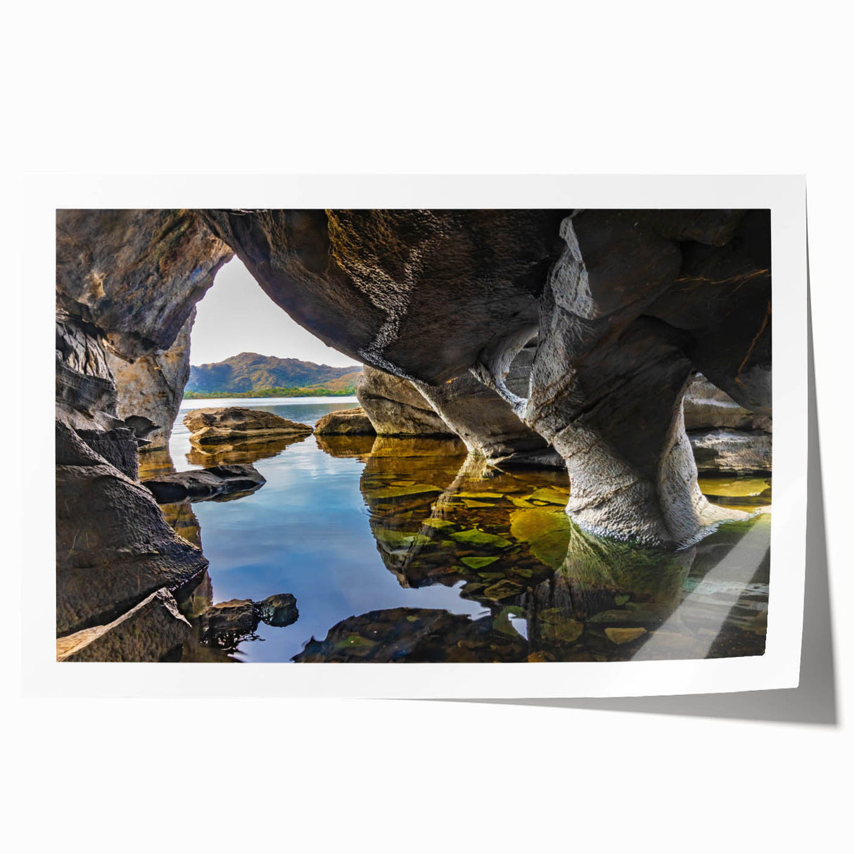 Rolled print of Irish scenery with vibrant green fields and a cloudy sky, ideal for dining room wall art.