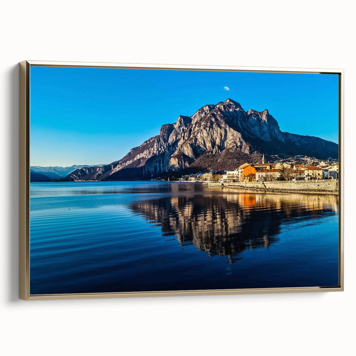 Framed canvas wall art depicting Lake Como with muted green and blue tones, vintage poster style, ideal for bedroom decor.