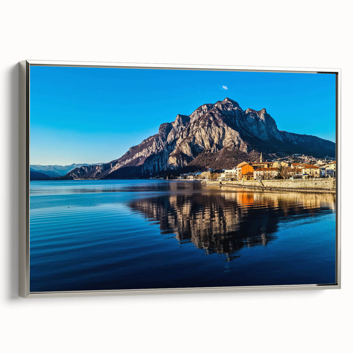 Landscape art painting of Lake Como with colorful vintage-style imagery on a black framed canvas.