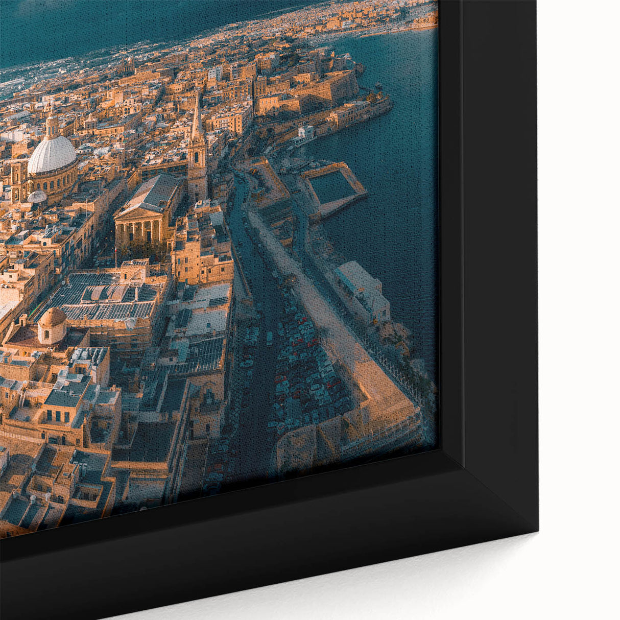 Black wall art featuring a textured depiction of a European Malta scenery in vibrant colors on a framed canvas.