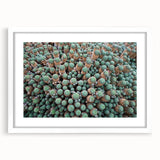 Textured abstract art print of a European scenery in muted earth tones, framed with a white mat, suitable for bedroom art.