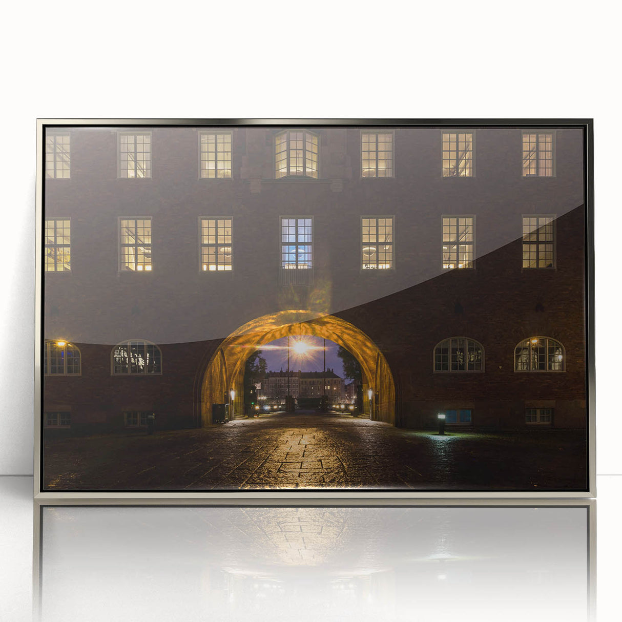 Mid-century modernist art depicting Stockholm’s skyline in muted gray and blue on a silver-framed acrylic print.