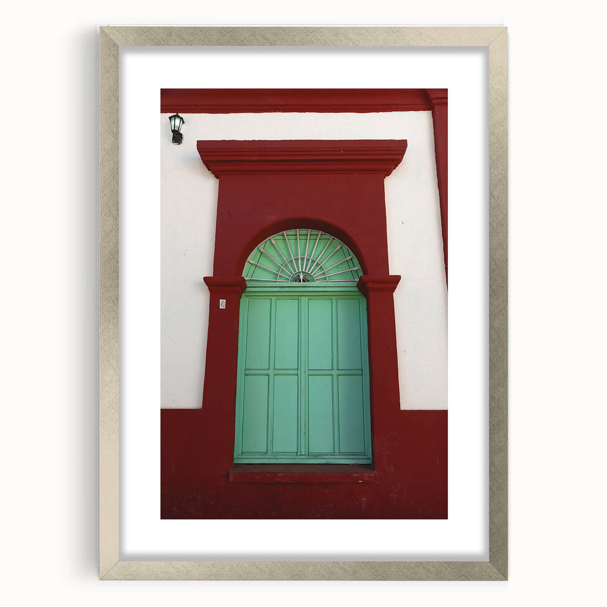 Textured abstract art print of Baja California scenery in a silver frame with a mat, featuring earthy tones.