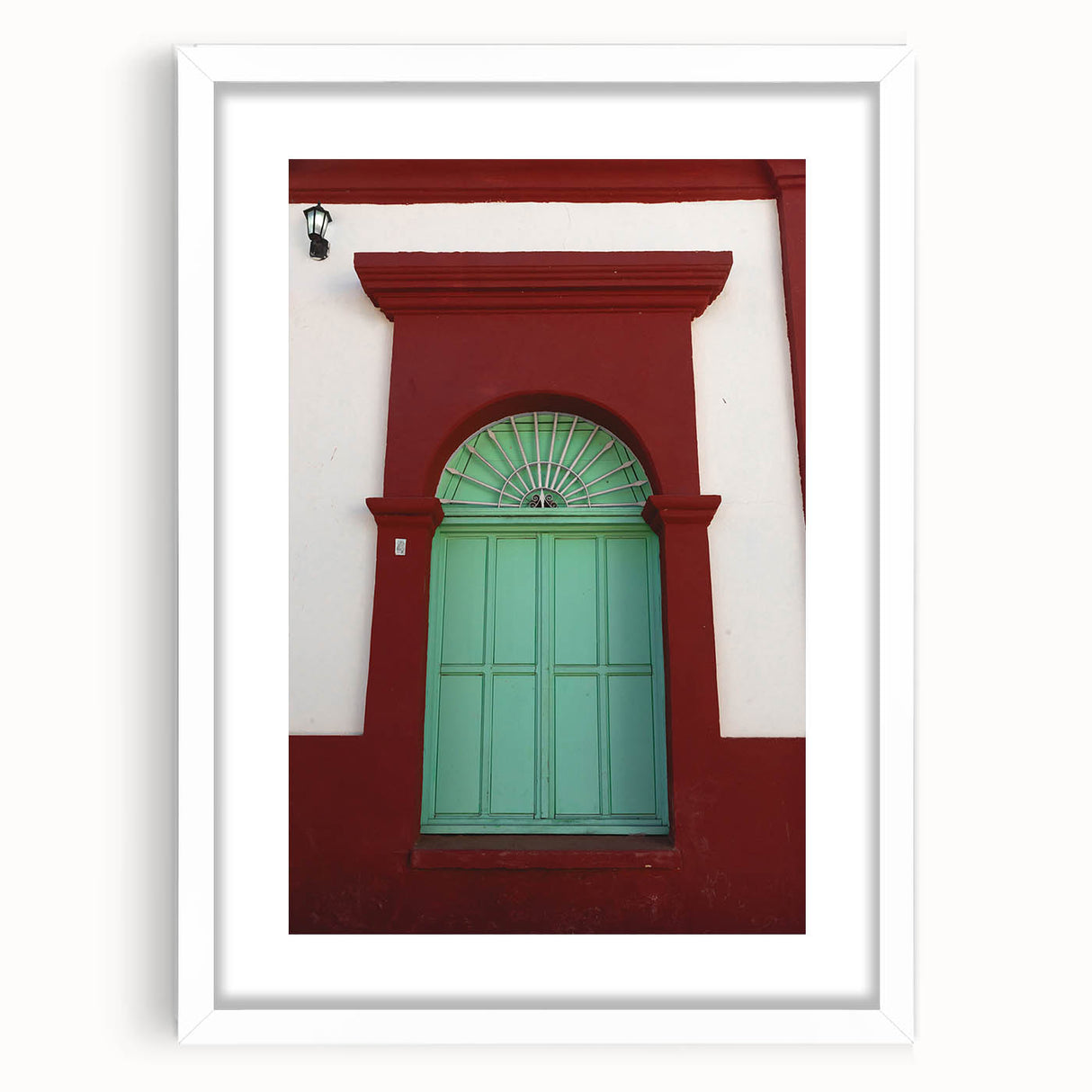 Abstract art print depicting the Baja California scenery in a mix of cool blues and greens, framed in white.