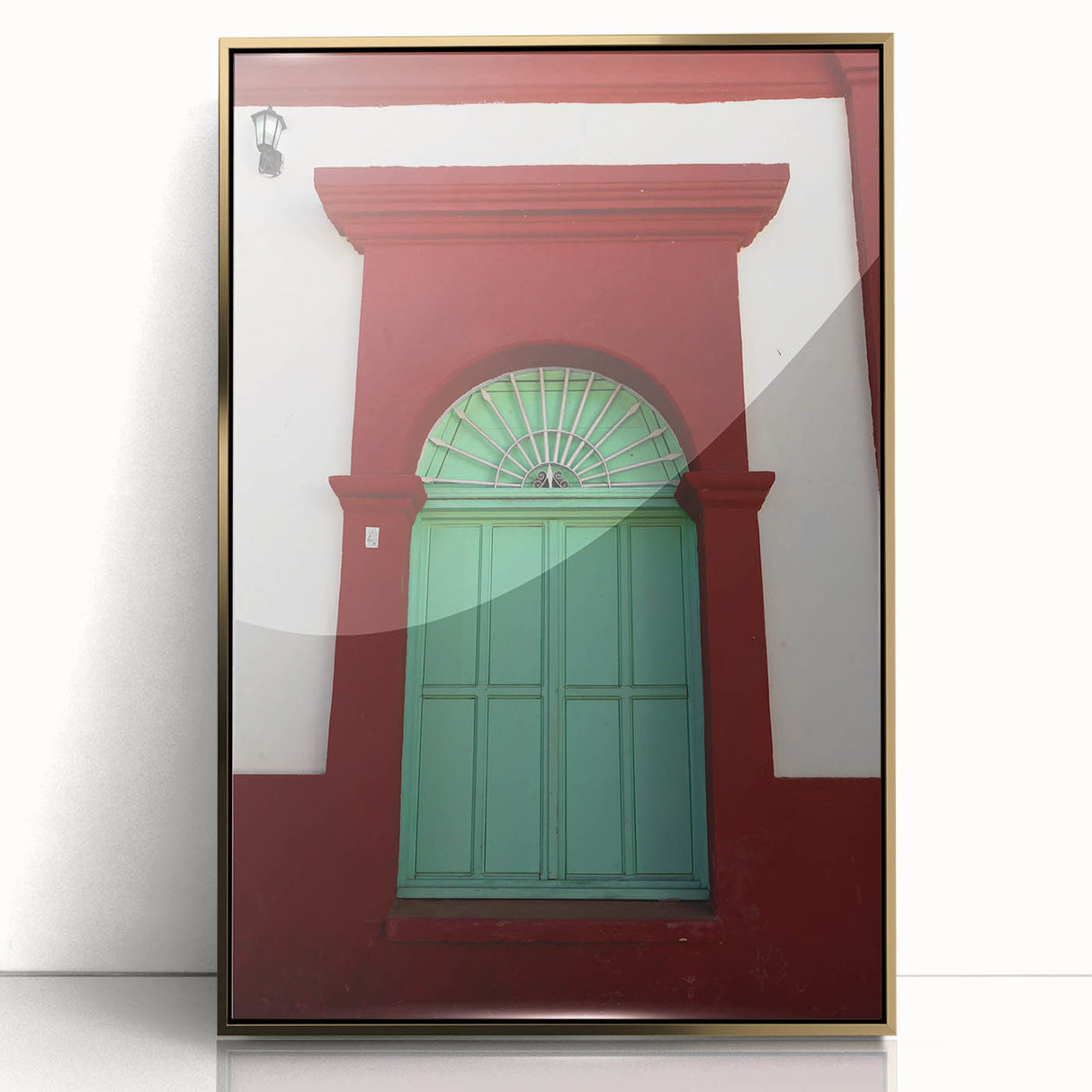Large art print of Baja California scenery on framed acrylic, featuring mid-century modernist style with gold accents.