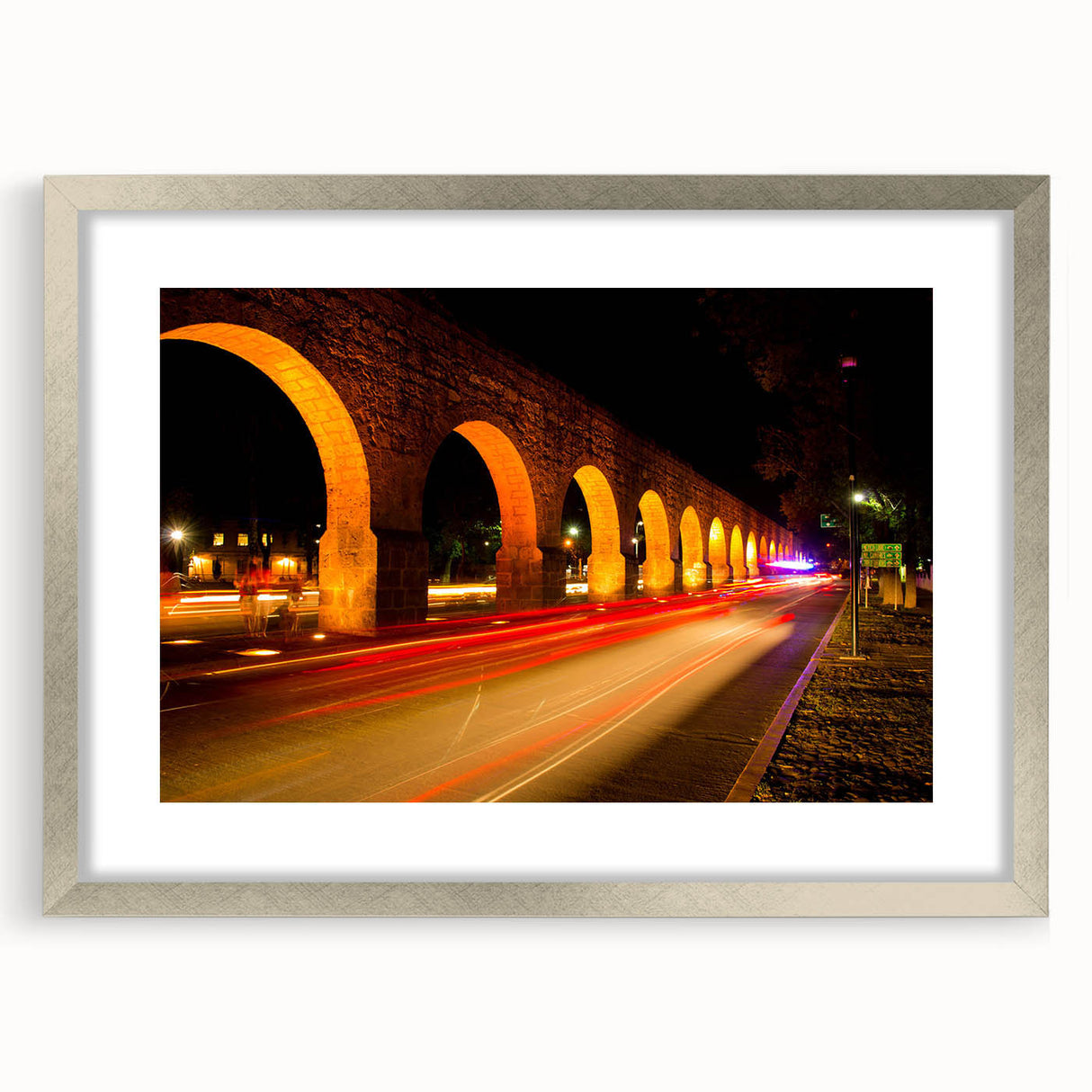Textured abstract art print of Mexico City, featuring muted earth tones on a framed silver mat, ideal for bedroom decor.