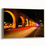 Framed canvas of Mexico City landscape in muted gold and black tones, ideal for bedroom wall art.