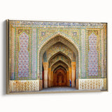 Framed canvas featuring a vintage-style landscape painting of a Middle Eastern scene in gold and black tones.
