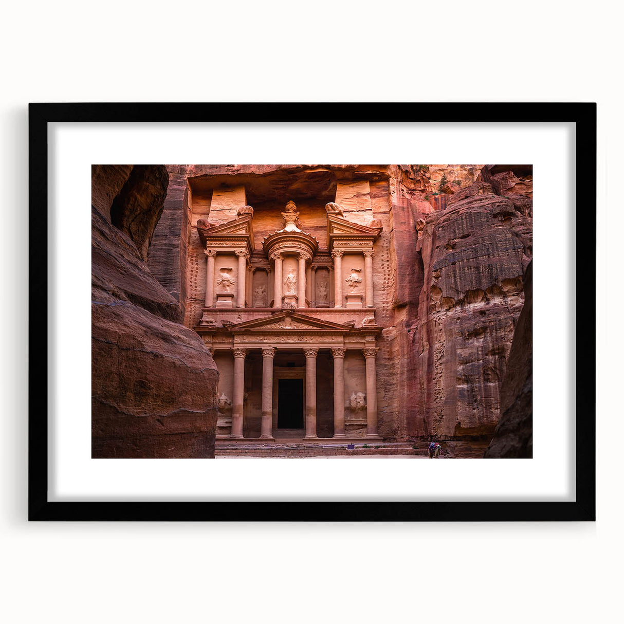 Extra large abstract art print of a colorful Jordanian landscape on textured canvas, framed in black.
