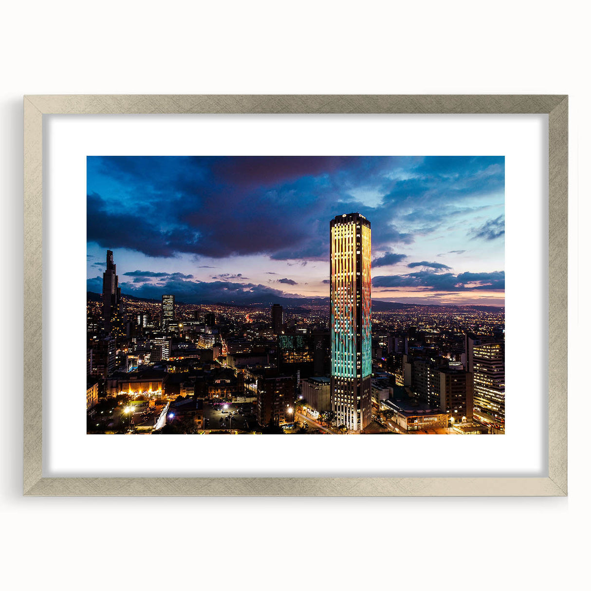 Textured abstract art print depicting a serene Colombian landscape, in soft earth tones on a framed silver mat.