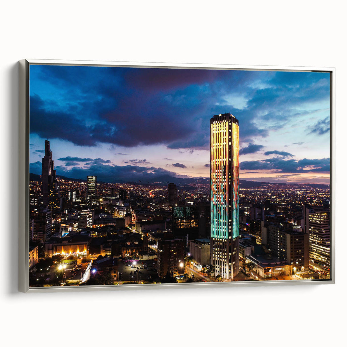 Landscape art painting of a Colombian scenery on a framed canvas, featuring vibrant colors against a black background.