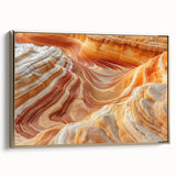 Framed canvas of Coyote Buttes in Arizona with golden hues and black borders, suitable as wall art for a bedroom.