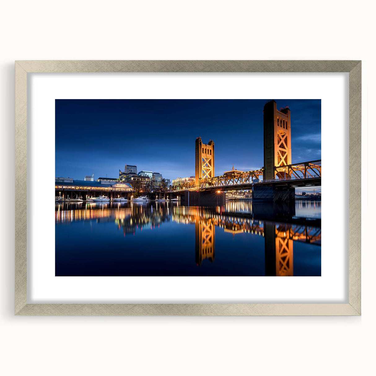 Textured abstract art print of Sacramento scenery in muted earth tones on a framed silver mat, suitable for bedroom decor.