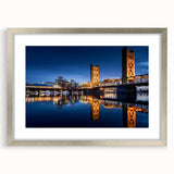 Textured abstract art print of Sacramento scenery in muted earth tones on a framed silver mat, suitable for bedroom decor.