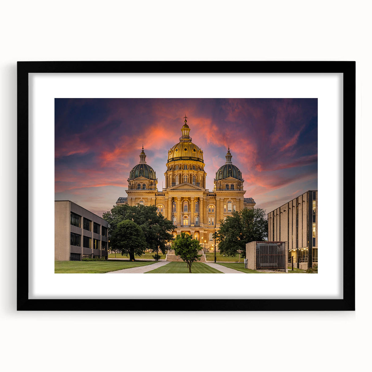 Abstract art print of Iowa scenery in vibrant, colorful hues on a large, textured canvas, framed in black.