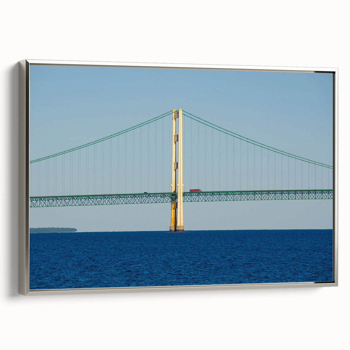 Landscape art painting of Michigan's Upper Peninsula on a framed canvas, featuring colorful autumn trees and a black border.