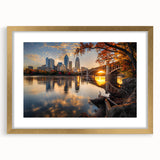 Extra large abstract art print of Minneapolis skyline in muted blue and gray tones, framed in gold.