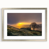 Textured abstract art print of Charlotte skyline in muted gray and blue tones, framed in silver, ideal for bedroom art.