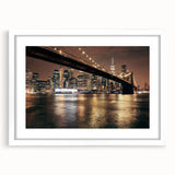 Abstract art print of the Brooklyn Bridge in muted gray and blue tones on a white framed canvas.
