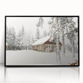 Large abstract wall art depicting a winter scene in muted blue and white tones on framed acrylic.