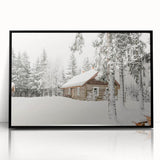 Large abstract wall art depicting a winter scene in muted blue and white tones on framed acrylic.