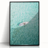 Large abstract wall art featuring swirling blue and green patterns on a black acrylic frame.