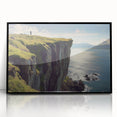 Framed acrylic artwork depicting dramatic cliffs with rich textures and vibrant colors, set against a sleek black frame, ideal for modern interior decor.