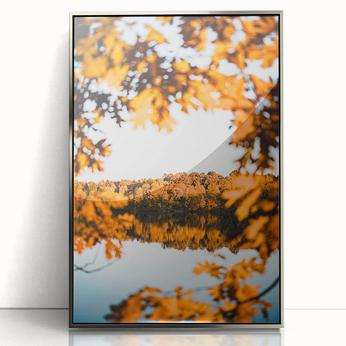 Mid-century modernist art depicting autumn trees in orange and yellow hues, framed in silver acrylic.