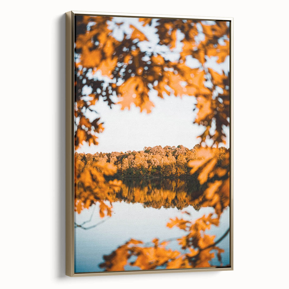 Framed canvas featuring a vintage-style landscape painting with autumnal trees in gold and black tones.