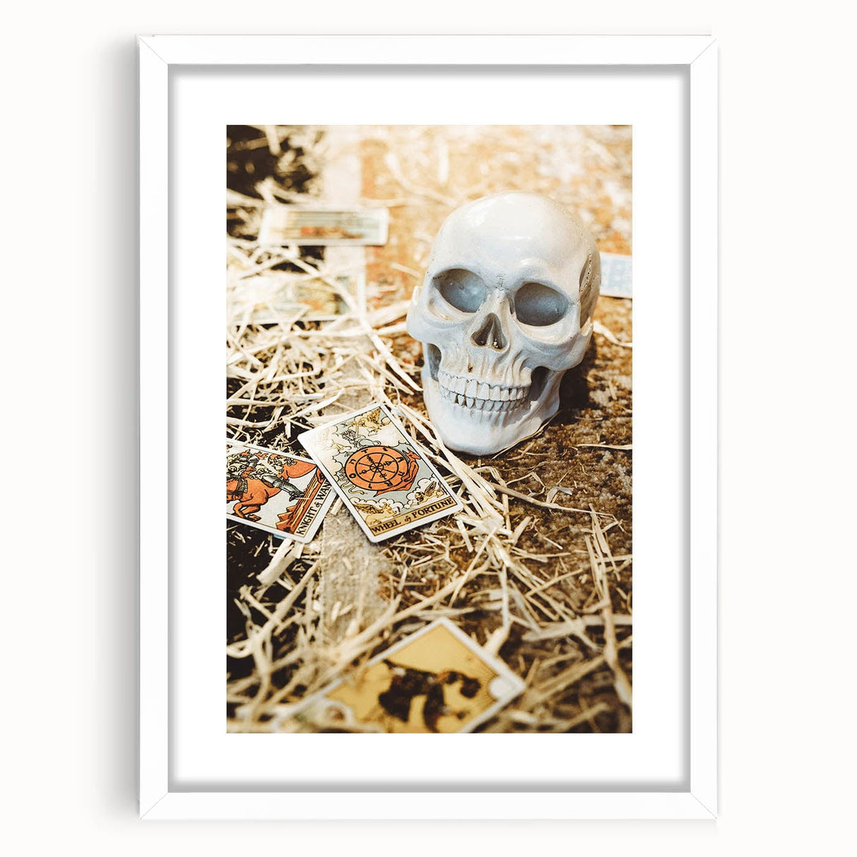 Abstract art print depicting autumnal trees in warm orange and red tones on a white framed canvas.