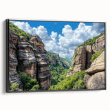 Framed canvas artwork depicting a dramatic cliff landscape with rich colors and intricate details, showcased from a black side view angle, perfect for home decor.