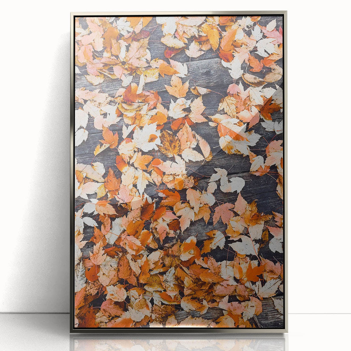 Mid-century modernist art depicting abstract fall foliage in warm orange tones, framed in silver acrylic.