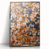 Mid-century modernist art depicting abstract fall foliage in warm orange tones, framed in silver acrylic.