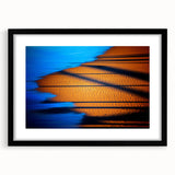 Abstract landscape wall art framed in black with a white mat, showcasing vibrant colors and bold brush strokes, ideal for modern home decor.