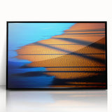 Framed abstract landscape wall art with a black frame, showcasing vibrant colors and fluid shapes, perfect for modern home decor or office settings.