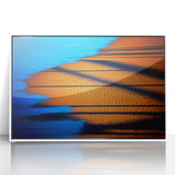 Framed abstract landscape wall art featuring vibrant colors and fluid shapes, set in a sleek white frame, ideal for modern home decor. This acrylic piece adds a contemporary touch to any room.