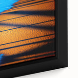 Close-up of an abstract landscape wall art piece featuring vibrant colors and intricate textures, framed in a sleek black border, ideal for modern decor.