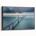 Framed canvas artwork showcasing a landscape view of a bridge, featuring a black frame and vivid colors, perfect for home decor and enhancing interior aesthetics.
