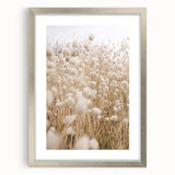 Textured art depicting abstract summer-themed imagery in vibrant orange and yellow hues on a silver-framed canvas.