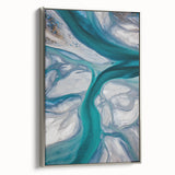 Framed canvas artwork showcasing serene desert dunes in soft beige and gold tones, accented with a sleek silver frame, ideal for modern home decor.