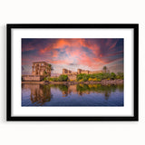 Abstract art print featuring textured, colorful depiction of Egyptian scenery on a large black-framed canvas.