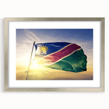 Extra large abstract art print of an African scenery in muted earth tones, framed in silver, ideal for living room decor.