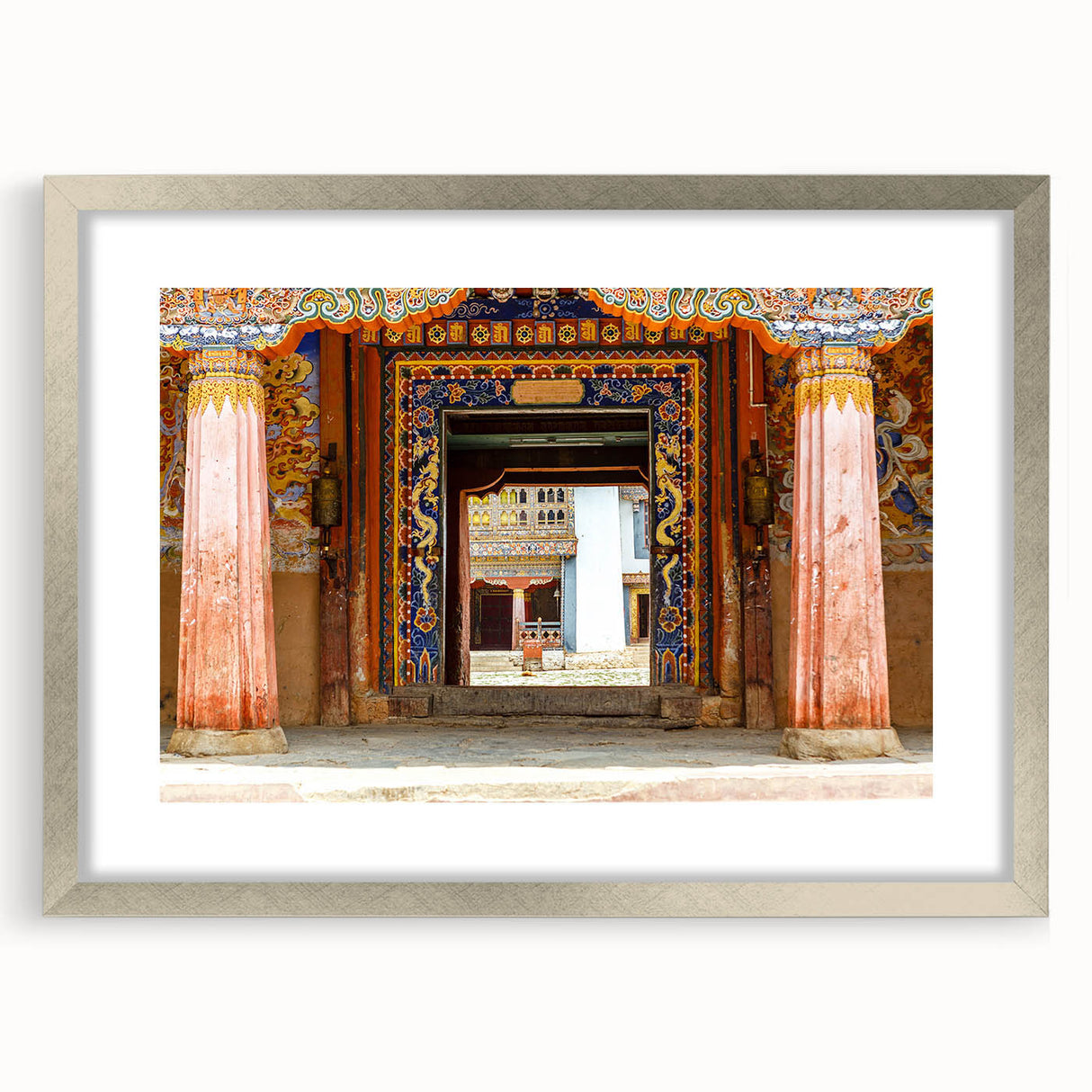 Textured abstract art print of Bhutan scenery in muted earth tones, framed with a silver mat, ideal for bedroom art.